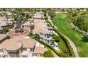 An elevated view showcasing a luxurious home near a golf course with meticulously manicured landscapes at 7475 E Gainey Ranch Rd # 22, Scottsdale, AZ 85258