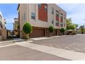 Contemporary townhome exterior with private garages and modern landscaping at 820 N 8Th Ave # 14, Phoenix, AZ 85007