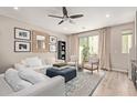 Bright living room with plush seating, stylish decor, and sliding glass doors to the outside at 820 N 8Th Ave # 14, Phoenix, AZ 85007