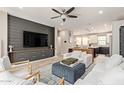 Comfortable living area featuring a large TV, plush seating, and stylish decor at 820 N 8Th Ave # 14, Phoenix, AZ 85007