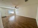 Bright living room with ceiling fan, natural light, and stylish wood-look flooring at 10101 N 91St Ave # 88, Peoria, AZ 85345