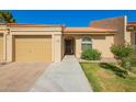 Charming single-story home with attached garage, manicured lawn, and inviting curb appeal at 1021 S Greenfield Rd # 1165, Mesa, AZ 85206