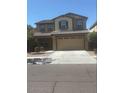 Two-story home with neutral paint, two-car garage, and low-maintenance landscaping at 10335 W Pima St, Tolleson, AZ 85353