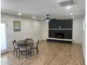 Cozy living room with a black brick fireplace and dining set at 1309 E Julie Dr, Tempe, AZ 85283