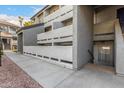 Exterior view of a well-maintained apartment building featuring balconies, stucco walls, and convenient access to walkways at 1331 W Baseline Rd # 167, Mesa, AZ 85202
