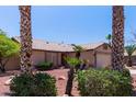Attractive single-story home with desert landscaping, a tile roof and a two-car garage, move-in ready at 20769 N 106Th Ln, Peoria, AZ 85382