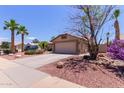 Charming single-story home with a well-manicured front yard and a two-car garage, in a desirable location at 20769 N 106Th Ln, Peoria, AZ 85382