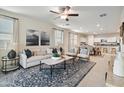 Open-concept living room with comfortable furniture and natural light at 22650 N Lynn St, Maricopa, AZ 85138