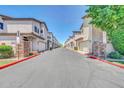Street view featuring multiple townhomes with private garages and manicured front yards at 3034 N 39Th St # 12, Phoenix, AZ 85018