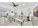 Bright living room featuring stylish furniture, ceiling fan, and contemporary decor at 3034 N 39Th St # 12, Phoenix, AZ 85018