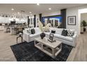 Open-concept living room featuring a plush sectional sofa and seamless transition to the outdoor patio at 3332 W Sunstone Dr, San Tan Valley, AZ 85144