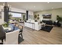Open-concept living room with sliding glass doors to outdoor space at 3419 W Sunstone Dr, San Tan Valley, AZ 85144