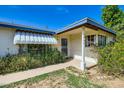 Charming single-story home featuring a covered porch, tidy landscaping, and an inviting entryway at 3944 E Oak St, Phoenix, AZ 85008