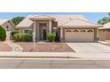 Charming single-story home with well-manicured landscaping and a two-car garage at 4137 E Stanford Ave, Gilbert, AZ 85234