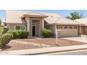 Inviting single-story home with a neutral color scheme and desert-friendly landscaping at 4137 E Stanford Ave, Gilbert, AZ 85234
