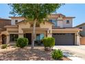 Inviting two-story home featuring a well-maintained front yard with desert landscaping and a spacious two-car garage at 44517 W Copper Trl, Maricopa, AZ 85139