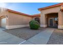 View of the entryway and a well maintained desert front yard at 5314 W Bowker St, Laveen, AZ 85339