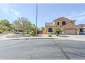 Charming two-story home with a stucco exterior, desert landscaping, and a two-car garage at 6922 S Black Hills Way, Chandler, AZ 85249