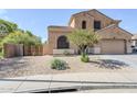 Charming home with desert landscaping, a paver driveway, and a well-maintained front yard at 6922 S Black Hills Way, Chandler, AZ 85249