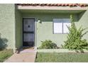 Inviting front entrance with a charming door and beautiful desert landscaping at 735 E Cochise Dr, Phoenix, AZ 85020
