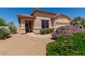 Beautiful one-story home with a tile roof, desert landscaping, and a two-car garage at 11691 W Cactus Wren Ct, Surprise, AZ 85378