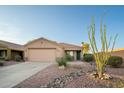 Charming single-story home with xeriscaped front yard and a large ocotillo cactus at 17416 W Ventura St, Surprise, AZ 85388