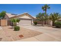 Charming single-story home with desert landscaping, a two-car garage, and a serene neighborhood setting at 3821 N 125Th Dr, Avondale, AZ 85392