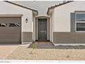 Close-up view of the front door and desert landscaping at 4035 S 176Th Dr, Goodyear, AZ 85338