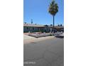 Cozy single-story home with a tidy front yard and vibrant landscaping at 4810 N 69Th Dr Dr, Phoenix, AZ 85033