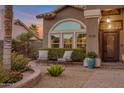 Charming home exterior featuring arched window, manicured landscaping, and front entryway at 630 W Saragosa St, Chandler, AZ 85225