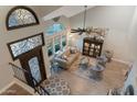 Bright living room with soaring ceilings, hardwood floors, and lots of natural light at 630 W Saragosa St, Chandler, AZ 85225
