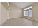 Bonus room with tile flooring, large windows for natural lighting and a ceiling fan at 6923 W Laredo St, Chandler, AZ 85226