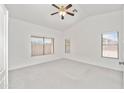 Bright bedroom with carpet, vaulted ceilings, and multiple windows providing natural light at 742 E Lovegrass Dr, San Tan Valley, AZ 85143