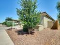 Attractive house showcasing desert landscaping, a well-kept lawn, and a pleasant outdoor space at 8140 W Lane Ave, Glendale, AZ 85303