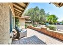 The home's large outdoor patio features brick accents and provides ample space for seating and entertaining at 8532 E San Bruno Dr, Scottsdale, AZ 85258