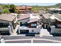 Aerial shot of a contemporary home featuring a balcony with stylish patio furniture at 1 Easy St # 17, Carefree, AZ 85377
