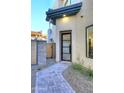 A modern front door with stylish glass panels and a welcoming stone pathway at 1 Easy St # 17, Carefree, AZ 85377