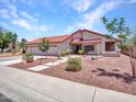 Inviting single-story home with a red tile roof and desert landscaping, perfect for curb appeal at 12641 S 39Th Pl, Phoenix, AZ 85044