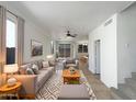 Inviting living room featuring neutral tones, plush seating, and stylish decor at 1415 E Chipman Rd, Phoenix, AZ 85040