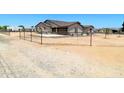 Single story home featuring an attached two car garage, neutral color palette, and fencing at 20310 W Hubbard Rd, Buckeye, AZ 85326