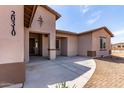 Charming single-story home with neutral stucco exterior, front yard and long driveway at 20310 W Hubbard Rd, Buckeye, AZ 85326
