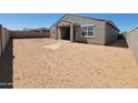 Large backyard featuring plenty of room to add a pool or other custom landscaping at 37194 W La Paz St, Maricopa, AZ 85138