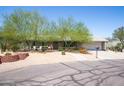 Charming single-story home with mature landscaping and a two-car garage at 851 E Village Circle N Dr, Phoenix, AZ 85022