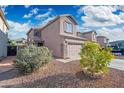 Side view of a charming home showcasing landscaping with stone accents and beautiful trees at 11383 W Pima St, Avondale, AZ 85323