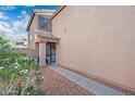 Inviting front entrance with security door, sidelight window and flowering plants at 11383 W Pima St, Avondale, AZ 85323