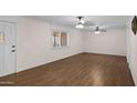 Living room featuring wood floors and neutral walls at 1158 N Barkley St, Mesa, AZ 85203