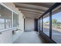 Enclosed porch with brick walls, neutral paint and large windows at 1158 N Barkley St, Mesa, AZ 85203