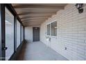 Covered porch with brick walls and windows offering natural light at 1158 N Barkley St, Mesa, AZ 85203