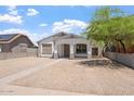 Charming single-story home featuring white stucco, front porch, and low-maintenance desert landscaping at 1510 W Fillmore St, Phoenix, AZ 85007