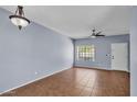 Living room with a ceiling fan, and an entry door at 2954 N Oregon St # 6, Chandler, AZ 85225